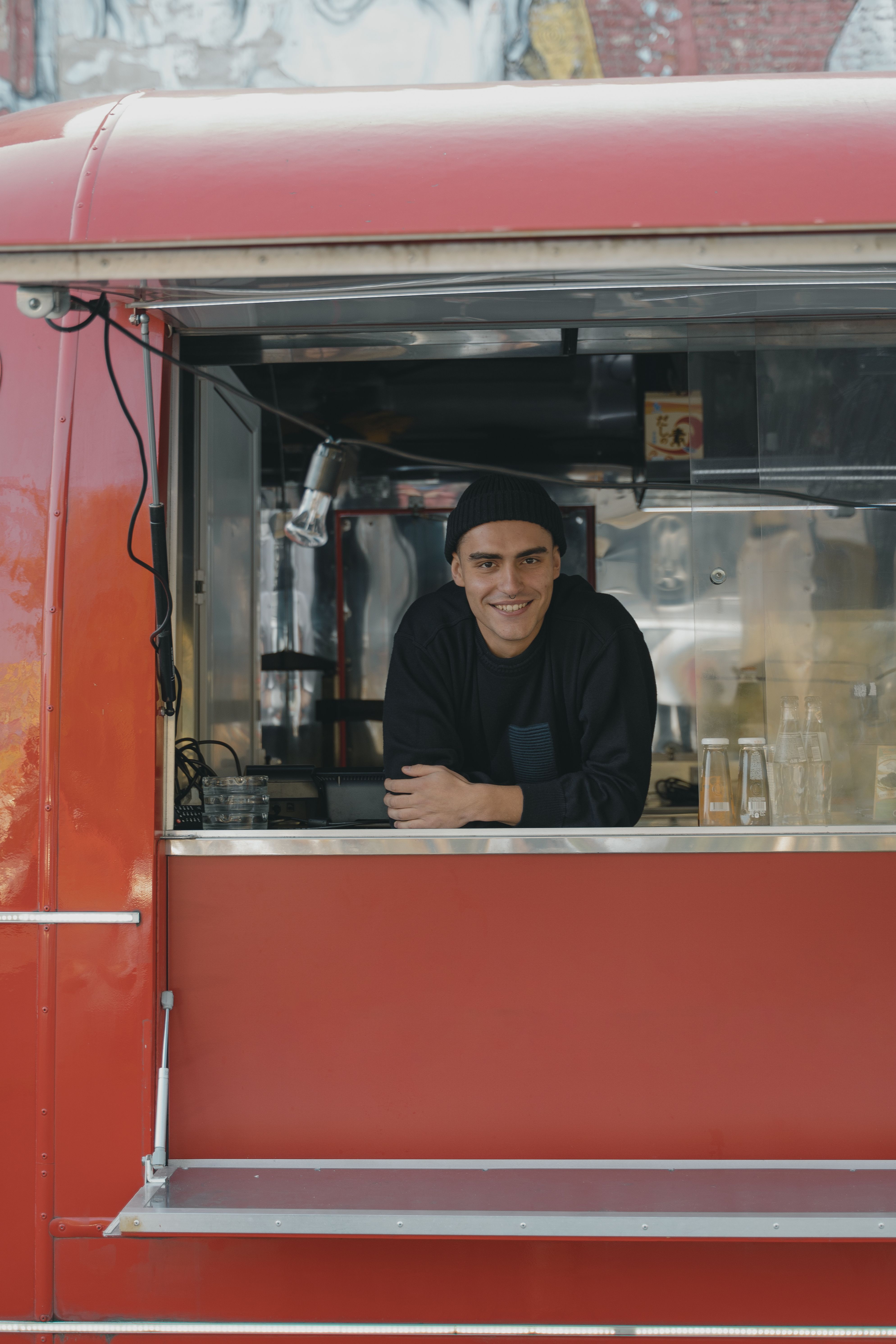 A food truck owner at the service window